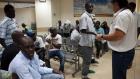 South Sudanese migrants receive instruction at the Immigration population Authority office in Eilat as they prepare to return to South Sudan, in southern Israeli city of Eilat June 12, 2012, where thousands of migrants reside. (AFP)