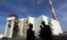 Iranian workers in front of the Bushehr nuclear power plant. (Stringer/Iran/Reuters)